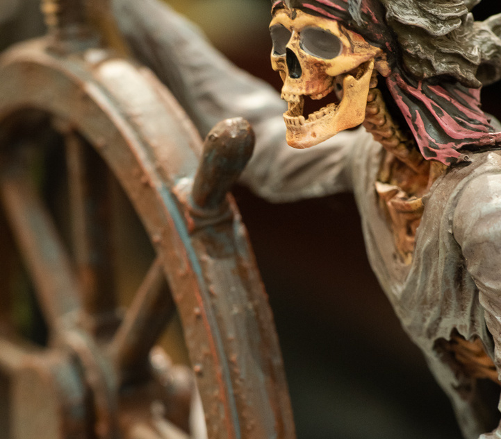 Skeleton helmsman figure