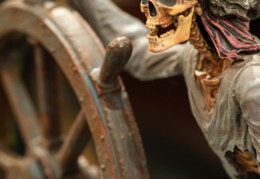 Skeleton helmsman figure