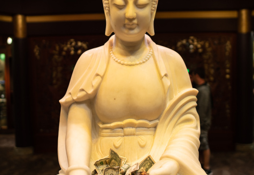 Buddha with money