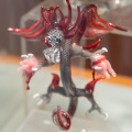 Glass dragon tearing apart pig